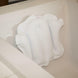 Bath pillow with suction cups attached inside a bathtub for added comfort and support during bathing